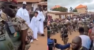 Trending video of interim President of Guinea, Mamady Doumbouya, taking a walk with his sons while being guided by heavily armed military men (video)