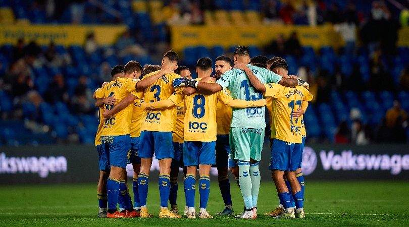 Las Palmas players in a huddle for a game against Mirandes in Spain