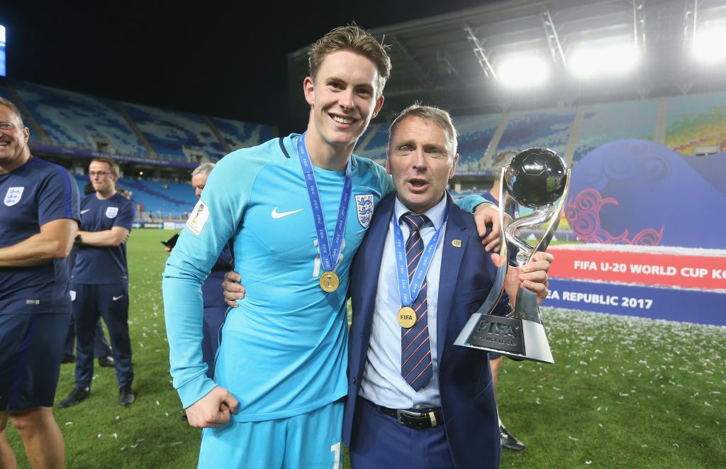 Dean Henderson of England and manager Paul Simpson ceebrate with the trophy after the FIFA U-20 World Cup Korea Republic 2017 Final match between Venezuela and England at Suwon World Cup Stadium on June 11, 2017 in Suwon, South Korea. (Photo by Alex Morton - FIFA/FIFA via Getty Images)