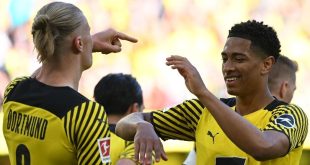 Erling Haaland and Jude Bellingham celebrate a goal for Borussia Dortmund against Wolfsburg in 2022.