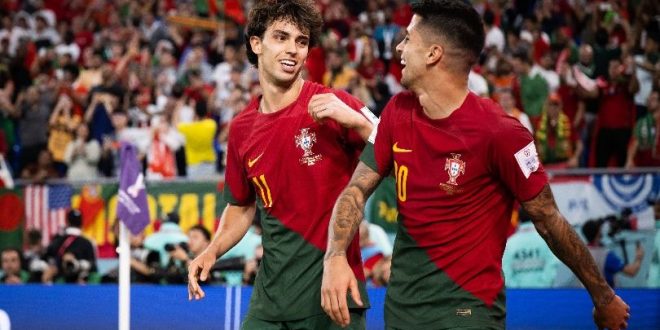 Joao Felix and Joao Cancelo celebrate a goal for Portugal at the 2022 World Cup in Qatar.