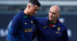 Portugal manager Roberto Martinez of Portugal speaks with Cristiano Ronaldo of Portugal during a training session at Cidade do Futebol FPF on June 13, 2023 in Oeiras, Portugal.