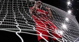 Trent Aleexander-Arnold looks dejected as he holds the back of the net after Tottenham