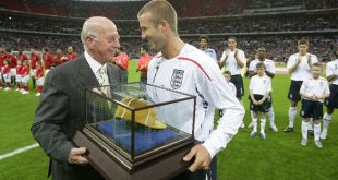 Sir Bobby Charlton presents David Beckham with his 100th England cap.