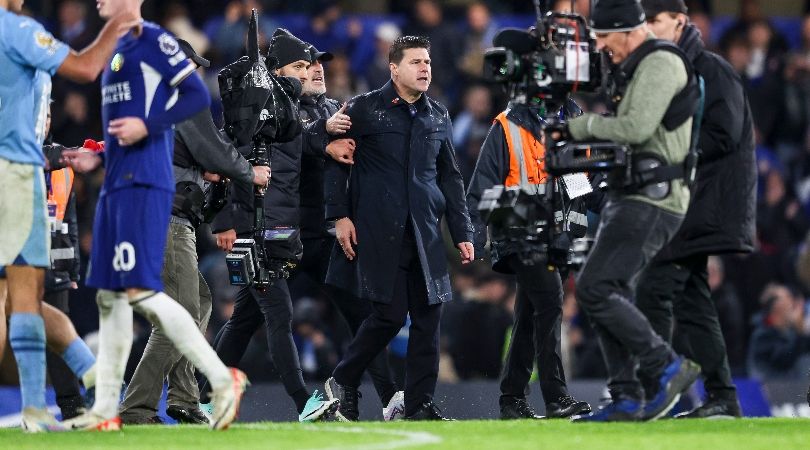 Mauricio Pochettino has to be restrained at full-time by colleagues after Chelsea