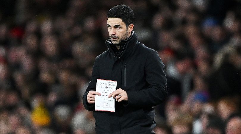 Arsenal manager Mikel Arteta holds a notepad during his side