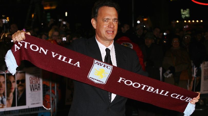Tom Hanks holds up an Aston Villa scarf at the premiere of Charlie Wilson