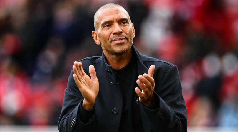 Stan Collymore applauds fans at the City Ground during Nottingham Forest