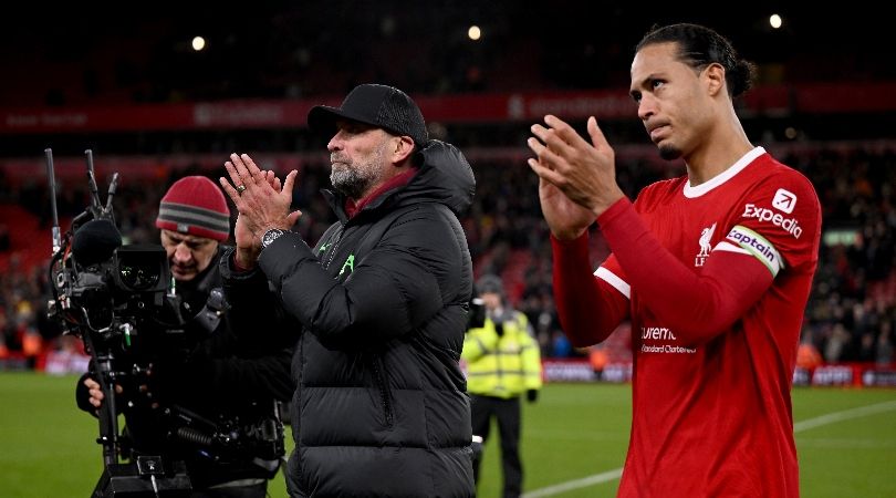 Jurgen Klopp and Virgil van Dijk applaud the Liverpool fans after the Reds