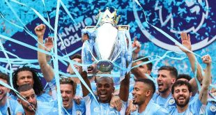Manchester City players celebrate with the Premier League trophy in 2023.
