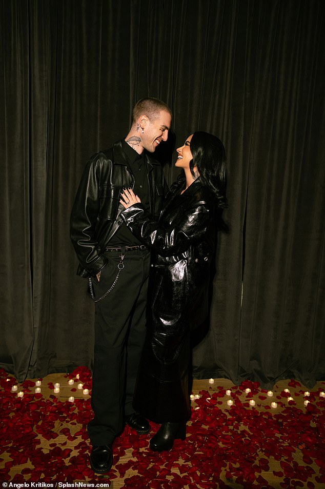 Singer  Demi Lovato flaunts her massive diamond ring as she gets engaged to her back-up singer Lutes (photos)