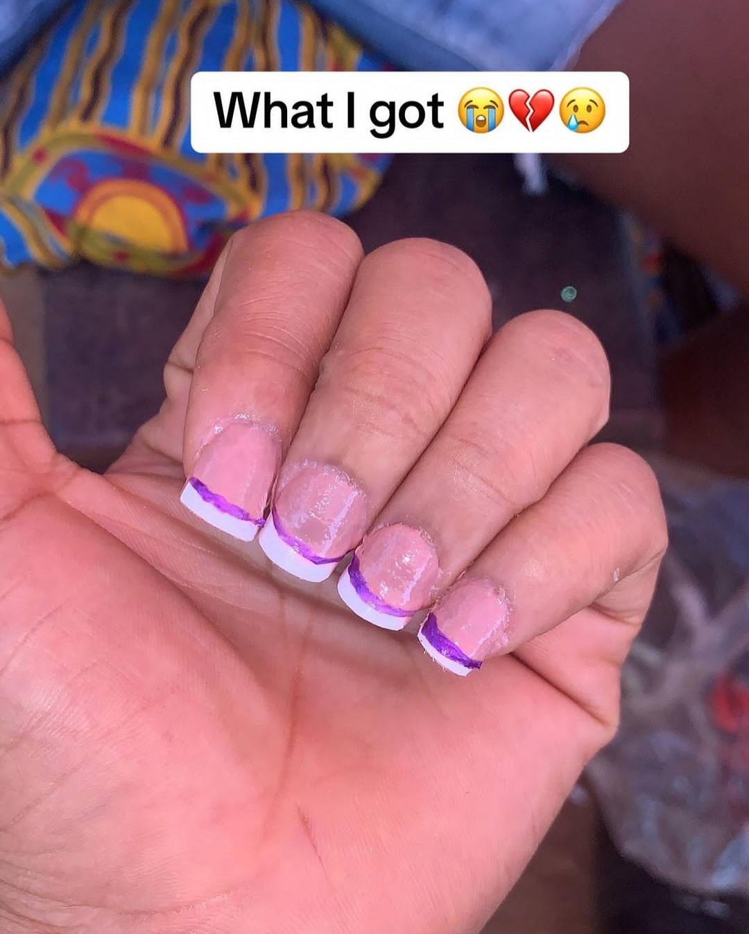 Woman shows nails she asked for and what her nail technician did for her