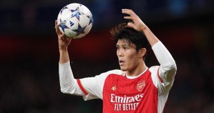 Takehiro Tomiyasu in action for Arsenal in the Champions League against Sevilla in November 2023.