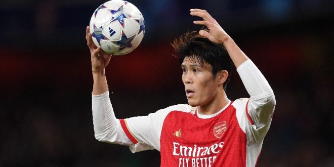 Takehiro Tomiyasu in action for Arsenal in the Champions League against Sevilla in November 2023.