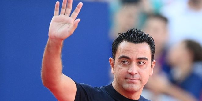 Barcelona coach Xavi waves to fans during the Gamper Trophy game against Tottenham in August 2023.