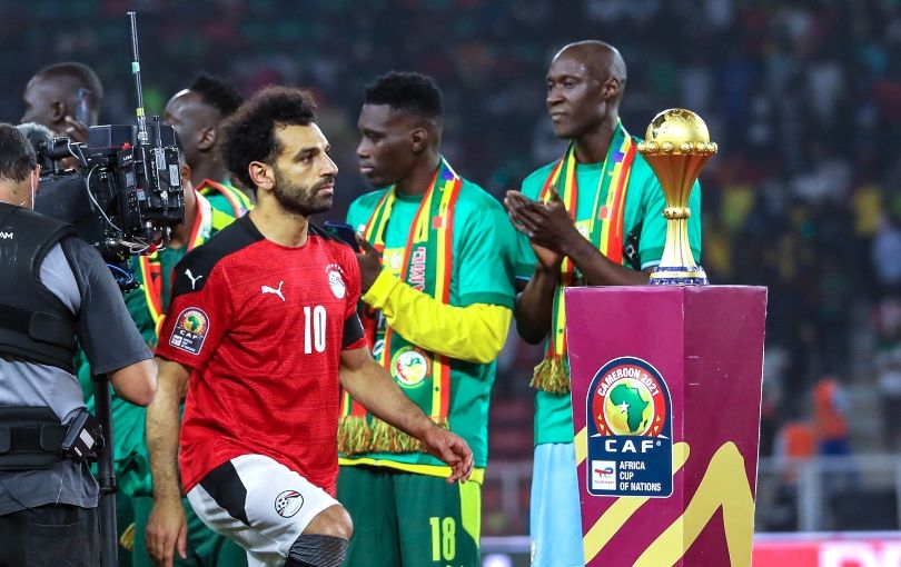 Egypt AFCON 2023 squad: Mohamed Salah walks past the AFCON trophy on the way to collect his runners-up medal
