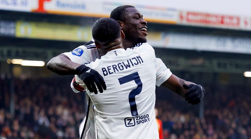 Brian Brobbey celebrates with Steven Bergwijn after scoring for Ajax against Go Ahead Eagles in January 2024.