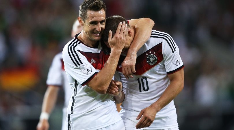 Miroslav Klose and Lukas Podolski celebrate a goal for Germany against Armenia ahead of the 2014 World Cup.