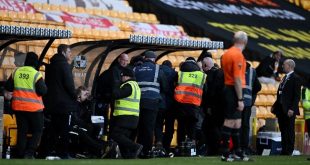 Port Valen ground stewards remove a fan who chased referee Craig Hicks off the pitch in a League One game against Portsmouth in January 2024.