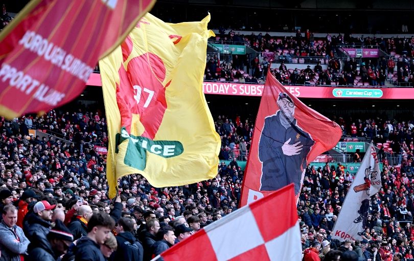 Liverpool fans wave flags at Wembley during the Carabao Cup final
