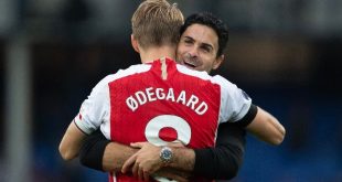 Arsenal manager Mikel Arteta embraces Martin Odegaard after a game against Everton in September 2023.