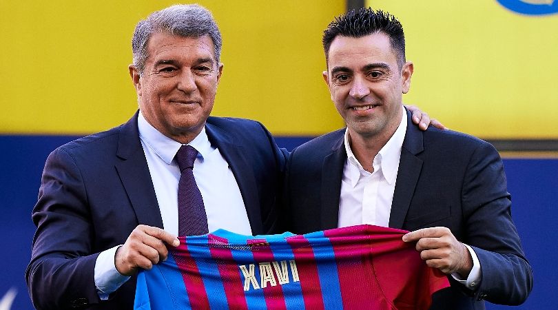 Barcelona president Joan Laporta and coach Xavi Hernandez at the latter