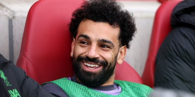 Mohamed Salah on the bench during Liverpool