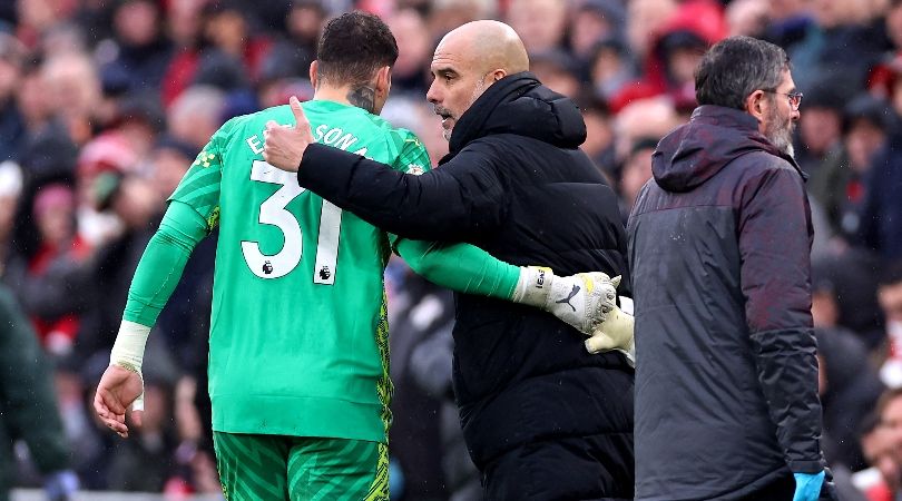 Ederson is consoled by manager Pep Guardiola as he is substituted in Manchester City
