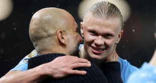 Manchester City manager Pep Guardiola embraces striker Erling Haaland after a win against Manchester United at Old Trafford in October 2023.