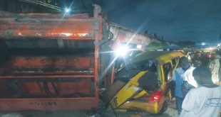 Refuse truck falls off bridge and kills tricycle rider in Lagos