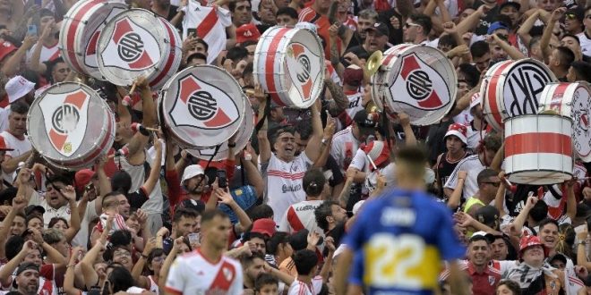River Plate fans cheer on their team and bang drums during a Superclásico against Boca Juniors in February 2024.
