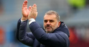Tottenham manager Ange Postecoglou applauds the fans after his side