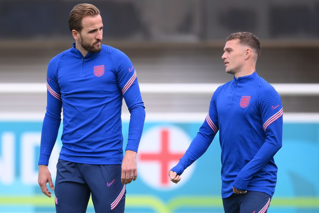 Harry Kane and Kieran Trippier of England speak as they walk out prior to the England Training Session at St George