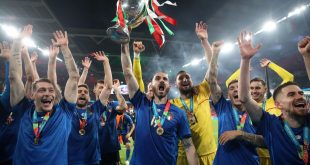 Italy players celebrate with the Henri Delaunay Cup after winning Euro 2020