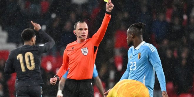 Michy Batshuayi of Belgium receives a yellow card from referee Sebastian Gishamer during a friendly football game between the national teams of England and Belgium in preparation on the UEFA Euro 2024 tournament, on March 26, 2024 in Wembley Stadium, London, England, United Kingdom. (Photo by Isosport/MB Media/Getty Images)
