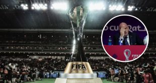 The Club World Cup trophy on a plinth with a roundel of FIFA President Gianni Infantino holding his head to his hand