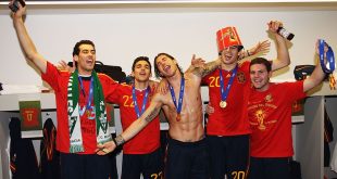 Sergio Busquets, Jesus Navas, Sergio Ramos, Javier Martinez and Juan Manuel Mata of Spain pose with the trophy in the Spanish dressing room after they won the 2010 FIFA World Cup at Soccer City Stadium on July 11, 2010 in Johannesburg, South Africa