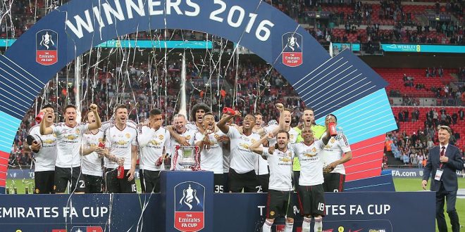The Manchester United squad celebrate with the FA Cup trophy after The Emirates FA Cup final match between Manchester United and Crystal Palace at Wembley Stadium on May 21, 2016 in London, England. (Photo by Tom Purslow/Manchester United via Getty Images)