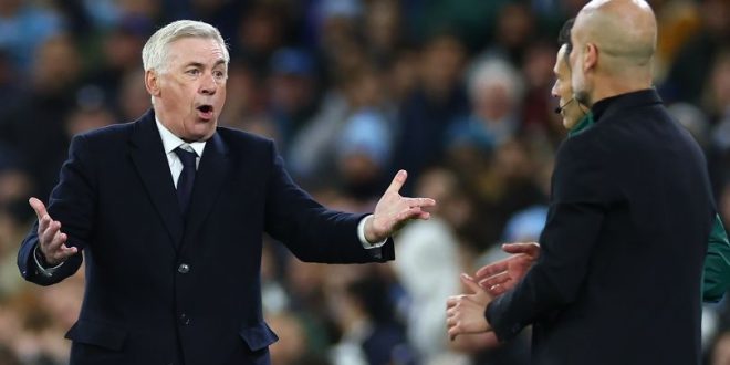 Real Madrid coach Carlo Ancelotti gestures to Manchester City manager Pep Guardiola during a Champions League match in April 2024.