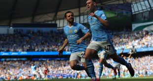 Phil Foden of Manchester City celebrates with teammate Bernardo Silva after scoring his side