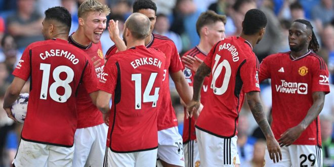 Manchester United players celebrate after victory over Brighton and Hove Albion.