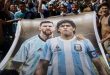 Argentina fans hold a banner with images of Lionel Messi and Diego Maradona during celebrations of their 2022 World Cup win in Buenos Aires in December 2022.