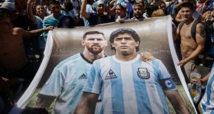 Argentina fans hold a banner with images of Lionel Messi and Diego Maradona during celebrations of their 2022 World Cup win in Buenos Aires in December 2022.