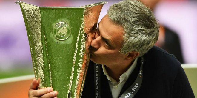 Jose Mourinho kissing the Europa League trophy