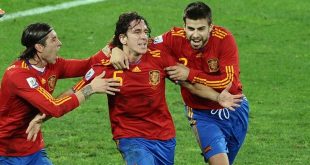 Sergio Ramos and Gerard Pique celebrate with Carles Puyol after his goal for Spain against Germany at the 2010 World Cup.