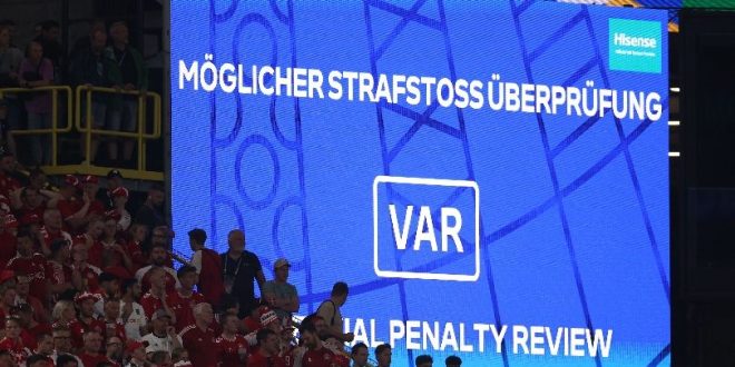 The VAR screen in Germany vs Denmark at Euro 2024 announces a VAR review for a possible penalty in favour of Germany for a Joachim Andersen handball.