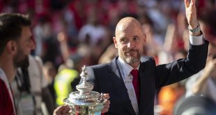 Erik ten Hag celebrates with the FA Cup trophy after Manchester United