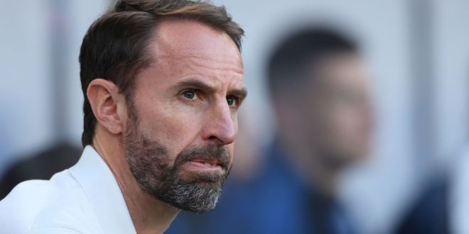 Gareth Southgate in the technical area clapping for England at St. James