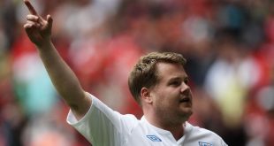 James Corden, wearing an England shirt, celebrates after scoring a penalty during the half-time interval of the Community Shield in August 2011.