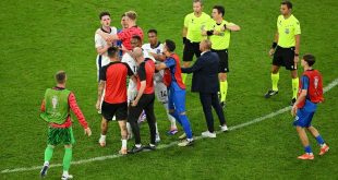 England midfielder Declan Rice clashes with Slovakia coach Francesco Calzona after the teams